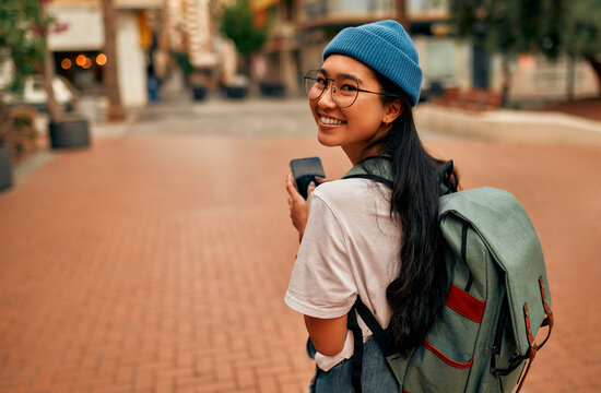asian female tourist student on city streets