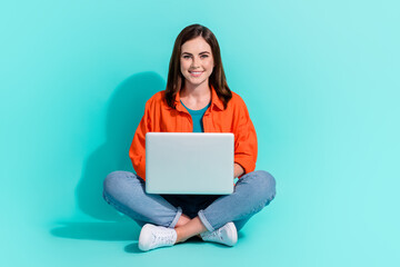 Canvas Print - Full length photo of charming shiny girl dressed orange shirt chatting twitter telegram isolated turquoise color background