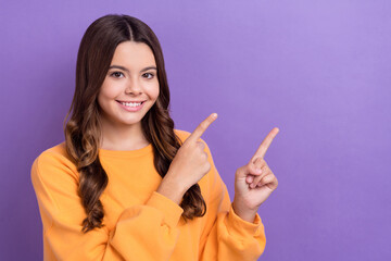 Wall Mural - Photo of lovely cute lady wear trendy orange jumper two arm direct empty space special deal isolated on purple color background