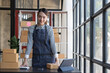 © wichayada - Portrait of Asian young woman SME working with a box at home the workplace.start-up small business owner, small business entrepreneur SME or freelance business online and delivery concept.