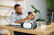 © prostooleh - Focus on a virtual reality glasses standing a table of black businessman