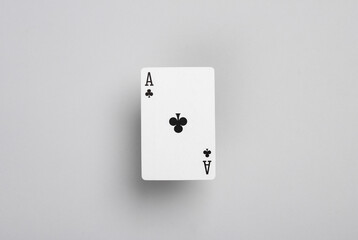 Ace of clubs on gray background