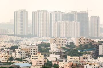 Aerial view of the densely packed concrete buildings in the urban cityscape of Hyderabad.