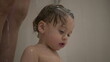 © Marco - Cute baby toddler boy inside shower bath