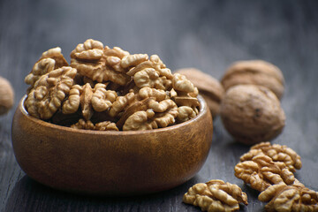 Poster - walnuts in bamboo wooden bowl