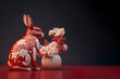Chinese New Year 2023 year of the rabbit. Porcelain red bunny background card, flowers. Generative ai