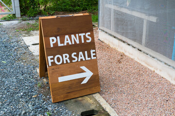 Plant For Sale sign on floor at farm.