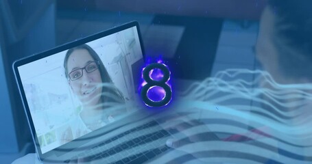 Poster - Animation of burning number eight over caucasian businesswoman having video call