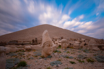 View of mount Nemrut and monumental sculptures of commagene kings and gods with colorful clouds and sky