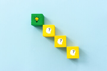 Wall Mural - Yellow bright light bulb and question mark over blue background