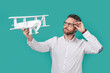 © be free - ambitious man launch aspirations with plane. photo of man launch aspirations with toy plane
