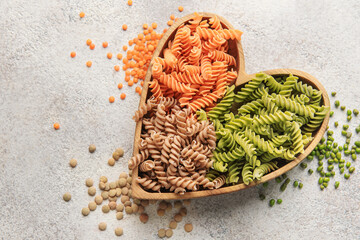 Wall Mural - A variety of fusilli pasta from different types of legumes. Gluten-free pasta.