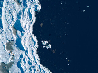 aerial view of lake or sea ice formations in finland. cracked ice from drone view.