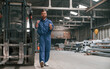 © standret - With the forklift. Factory worker in blue uniform is indoors