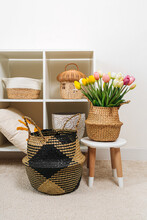 Home Interior With Spring Decor. White Shelving With Various Baskets And Bouquet Of Tulips. Seagrass Belly Basket , Cloth, And Wicker  Baskets For Storage Laundry And Toys Or Can Use As Cachepot.