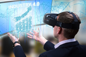 Wall Mural - Business, Technology, Internet and network concept. Young businessman working on a virtual screen of the future and sees the inscription: Industry 4.0