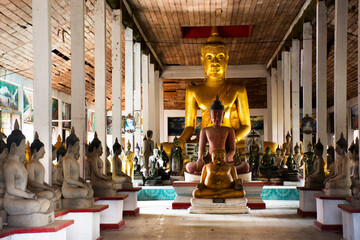 Ancient antique buddha statue and ruins old building for thai people travel visit and respect praying blessing wish holy mystery worship in Wat Phra Si Rattana Mahathat temple in Suphan Buri, Thailand