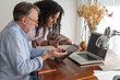 © ADDICTIVE STOCK - Diverse freelancers working on digital tablet at home