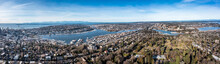 Seattle, Washington - Jan. 2023, Panoramic Aerial Landscape View Of The Area Around Lake Union And Lake Washington In Seattle With Space Needle And Snow Covered Mountains In Background