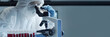 © Acronym - Scientist in protection suit and masks working in research lab using laboratory equipment: microscopes, test tubes. Coronavirus 2019-ncov hazard, pharmaceutical discovery, bacteriology and virology.