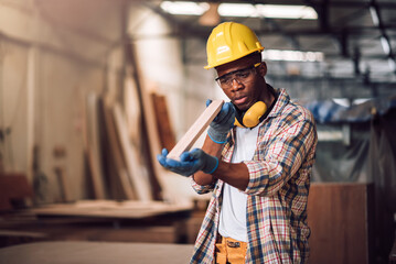 Young adult men carpenter craftman working in small business wood workshop. Timber industry and furniture industry.