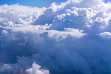 Wall Mural - Clouds view from the plane. Clouds are moving on camera. Flying through the cloud. Travel by air. Perfect for cinema, background