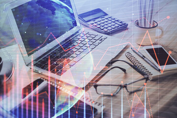 Poster - Financial chart drawing and table with computer on background. Multi exposure. Concept of international markets.