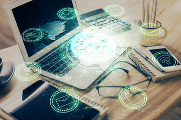 Poster - Computer on desktop with social network hologram. Double exposure. Concept of international people connections.