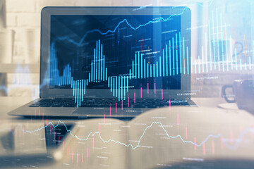 Poster - Financial chart drawing and table with computer on background. Multi exposure. Concept of international markets.