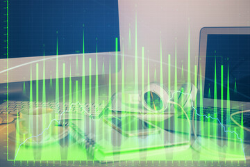 Poster - Financial chart drawing and table with computer on background. Multi exposure. Concept of international markets.