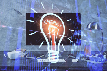 Poster - Computer on desktop in office with bulb icon hologram. Multi exposure. Concept of idea.