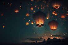  A Group Of Lanterns Flying In The Sky At Night Time With Stars And Clouds In The Background And A Mountain Below It With A Few Rocks And A Few Lights On The Ground Below It.