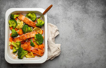 Top View Of Healthy Baked Fish Salmon Steaks, Broccoli, Cauliflower, Carrot In Casserole Dish On Gray Stone Background. Cooking A Delicious Low Carb Dinner, Healthy Nutrition Concept. Space For Text
