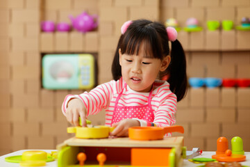 Sticker - young girl pretend playing food preparing at home