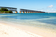 Abandoned Florida Overseas Railway Bridge Over Blue Ocean Water Of Gulf Of Mexico, Calusa Beach In Florida Keys, Bahia Honda State Park,