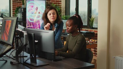 Poster - Team of office workers brainstorming ideas to create 3d content in creative agency studio, using professional pc software. Young female employees working on digital project development.