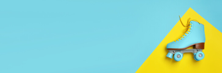 Wall Mural - stylish quad roller skate on color background, top view with space for text. banner design