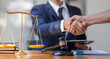 Businessman handshake to seal a deal Judges male lawyers justice and law concept. male lawyer working in office. Legal law, advice and justice concept.