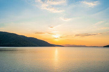 Wall Mural - sunset on the lake,background sky during sunset and water reflections.