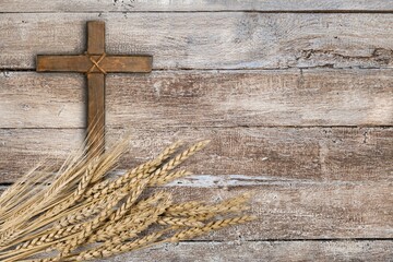 Wall Mural - Wood cross and golden wheat on desk
