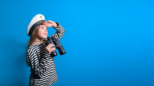 Banner Of A Sailor Girl On A Blue Background Teenage Girl In A Sailor Suit With A Binocular Looking Into The Distance