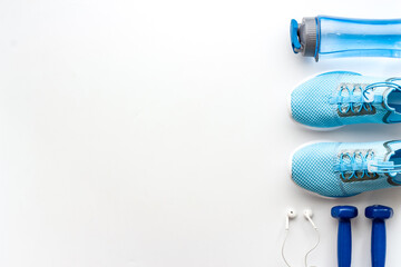 Athletics set with sneakers and dumbbells, top view