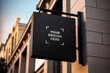 © Carkhe - Black square signboard mockup in outside for logo design, brand presentation for companies, ad, advertising, shops.