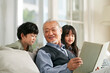asian grandpa having a good time with grandchildren