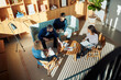 © Flamingo Images - Diverse businesspeople having a meeting in an office lounge