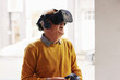 © Flamingo Images - Laughing senior man exploring a virtual world