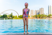 Happy Little Asian Girl  In Swimming Pool Portrait