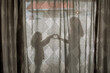 © Erin Brant/Stocksy - Mother and daughter heart hand silhouette