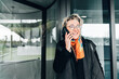 © AD Astra Team/Stocksy - A woman talking on smartphone in city