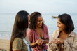 © Jovo Jovanovic/Stocksy - Happy female friends having fun at beach holiday during summer